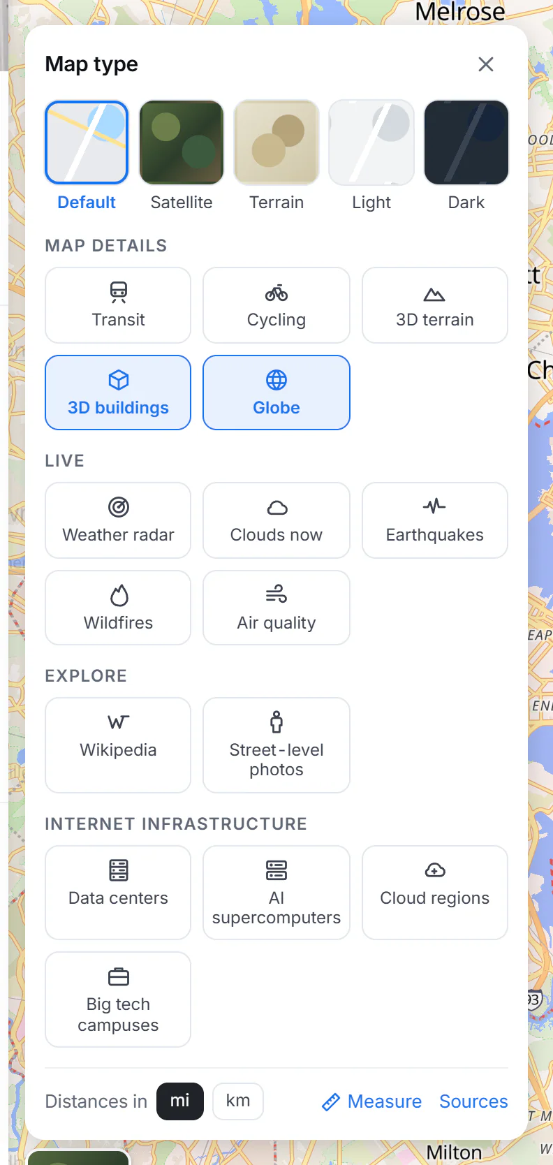 The Layers menu open over the map: five map types (Default, Satellite, Terrain, Light, Dark), then groups of switches for Map details, Live, Explore and Internet infrastructure, and at the bottom the distance units and a Measure button